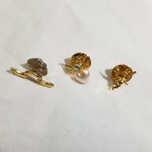 Three religious pins